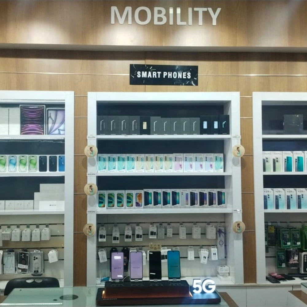 Modern electronics showroom at Oxygen Digital Shop Pattom featuring smartphones and laptop displays