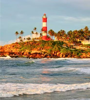 Kovalam Beach in Thiruvananthapuram with lighthouse and crescent shaped coastline in Kerala