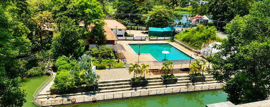 Akkulam tourist village aerial greenery coconut trees 